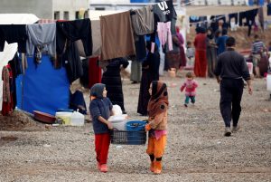 Trump suspends refugee program to defend U.S. against 'terrorists'