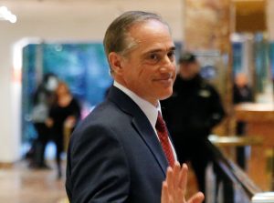 David Shulkin, Under Secretary of Health for the U.S. Department of Veterans Affairs, waves to a reporter after meeting in the lobby of Trump Tower in Manhattan, New York, U.S., January 9, 2017. REUTERS/Shannon Stapleton - RTX2Y845
