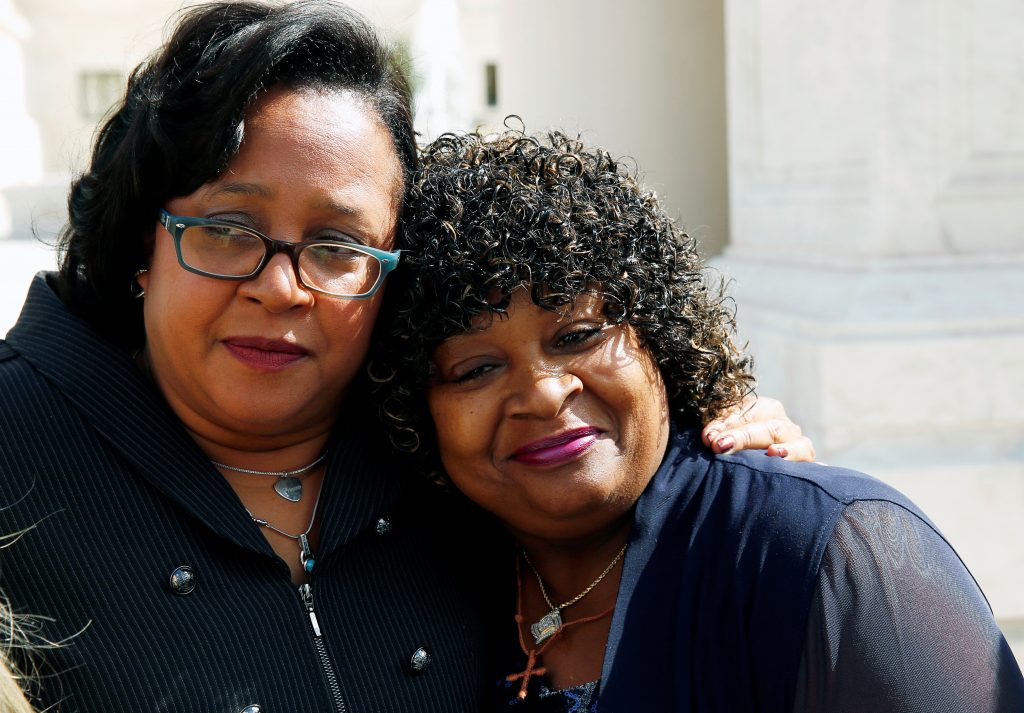 Lead counsel Christina Swarns (L) for Texas death row inmate Duane Buck (not pictured) hugs Buck's stepsister Phyllis Taylor in front of the U.S. Supreme Court in D.C. in 2016. Photo by Gary Cameron/Reuters