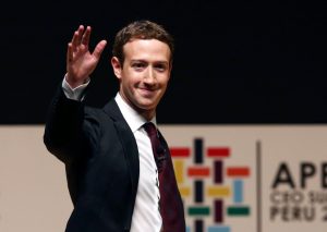 Facebook founder Mark Zuckerberg waves to the audience during a 2016 meeting of the APEC (Asia-Pacific Economic Cooperation) Ceo Summit in Lima, Peru. Photo by Mariana Bazo/Reuters