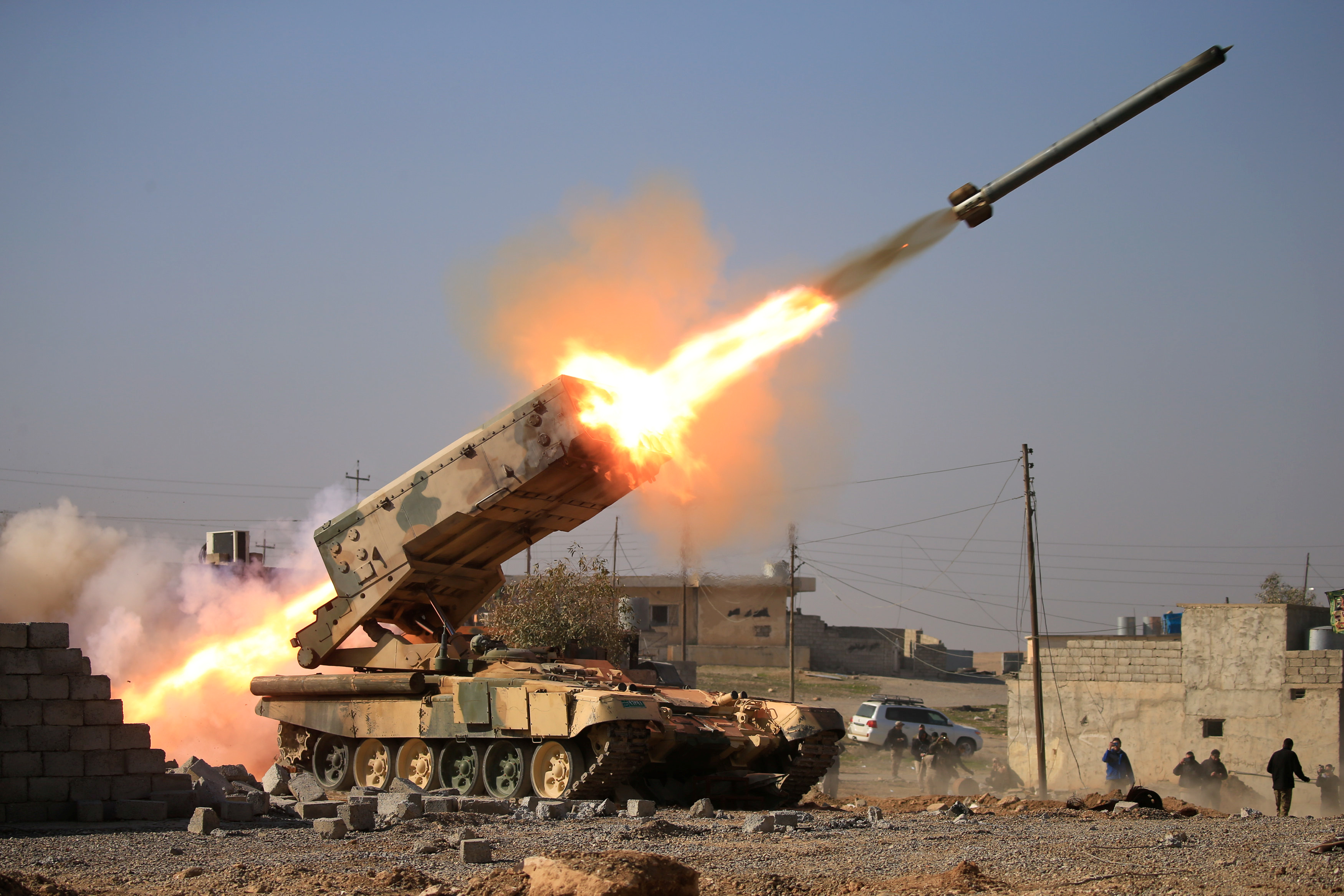 The Iraqi army launches a rocket toward Islamic State militants during a battle near Ghozlani military complex, south of Mosul, Iraq. Photo by Alaa Al-Marjani/Reuters