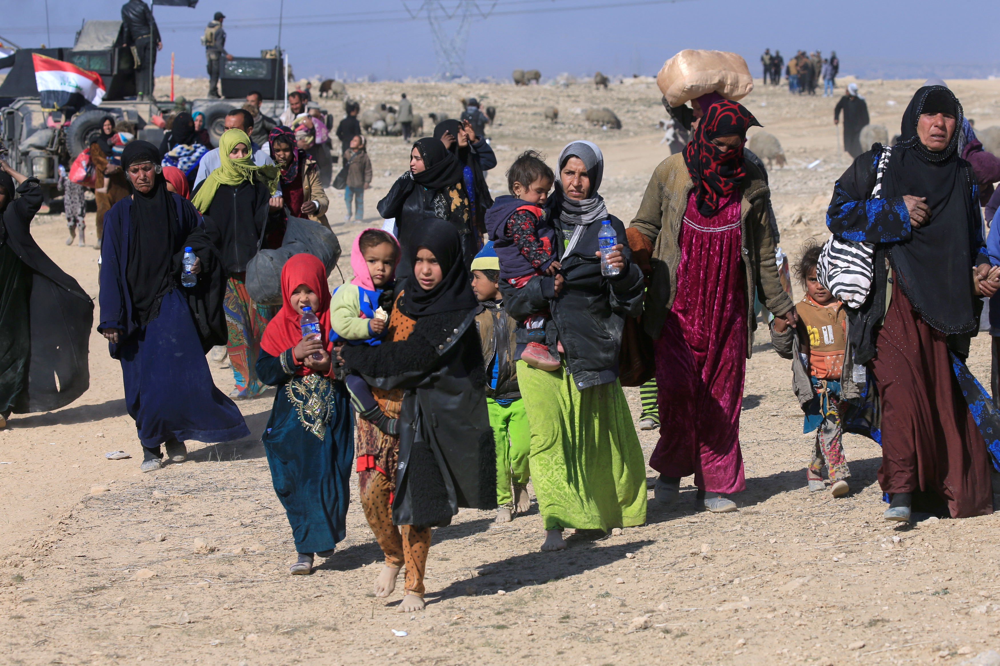 Some Iraqis flee during a battle with Islamic State militants in the district of Maamoun in western Mosul, but aid groups are finding that people tend to want to stay in their homes rather than go far distances to camps. Photo by Alaa Al-Marjani/Reuters