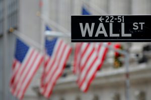 A street sign for Wall Street is seen outside the New York Stock Exchange (NYSE) in Manhattan, New York City. Photo by Andrew Kelly/Reuters