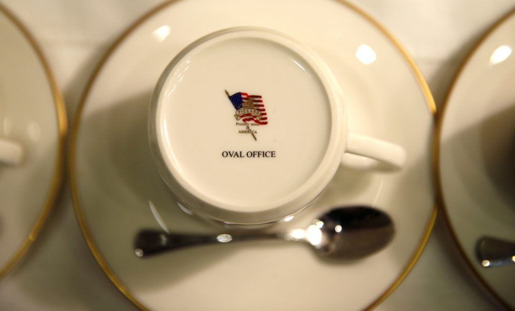 The words "Oval Office" adorn the bottom of a coffee cup during a meeting hosted by U.S. President Donald Trump with county sheriffs at the White House in D.C. Photo by Kevin Lamarque/Reuters