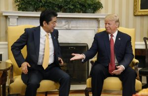 Trump hugs ally Japan after easing U.S.-China tensions