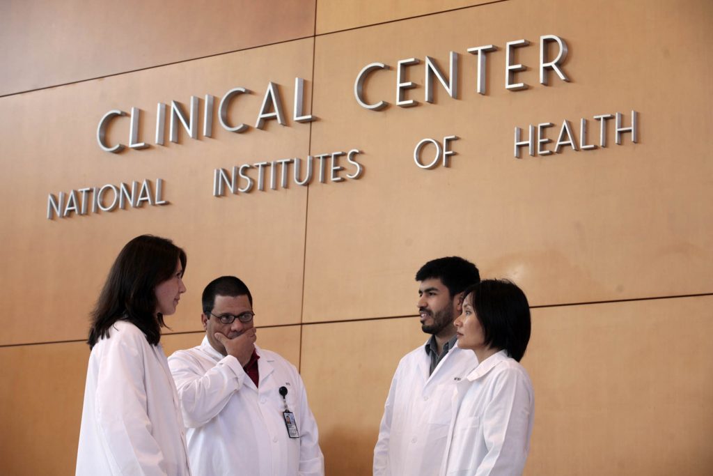 Patricia Burgos, Carlos Gonzalez, Jorge Contreras and Frances Calderon (left-right) stand in the lobby of the National Ins...