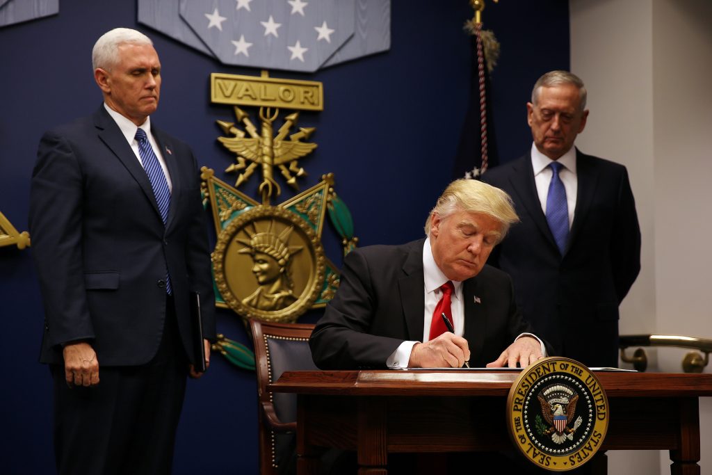 U.S. President Donald Trump signs a revised executive order for a U.S. travel ban on Monday, leaving Iraq off the list of ...