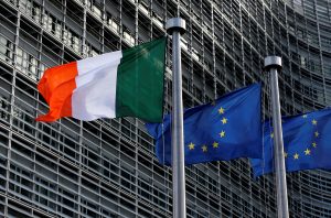 Irish and EU flags are pictured outside the EU Commission headquarters in Brussels