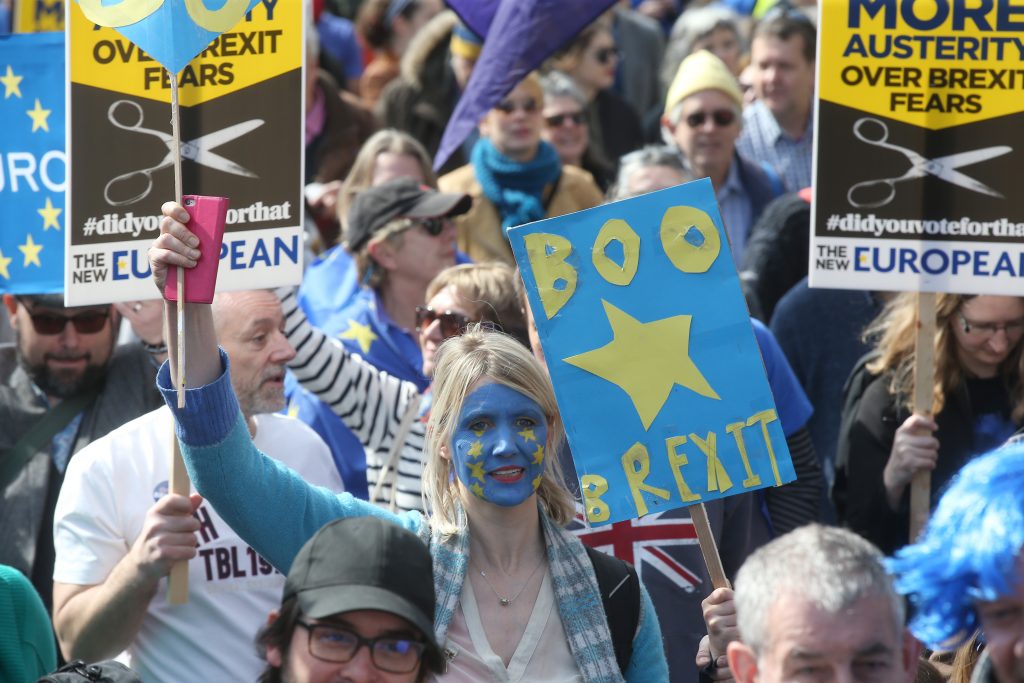 Demonstrators take part in a Unite for Europe march, as they head towards Parliament Square, in central London