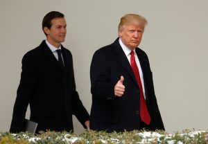 President Donald Trump gives a thumbs-up Mar. 15 as he and White House Senior Advisor Jared Kushner depart the White House in Washington, D.C. Photo by REUTERS/Kevin Lamarque.