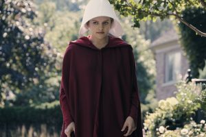 The Handmaid's Tale -- "Offred" Episode 101 -- Offred, one the few fertile women known as Handmaids in the oppressive Republic of Gilead, struggles to survive as a reproductive surrogate for a powerful Commander and his resentful wife. Offred (Elisabeth Moss), shown. (Photo by: George Kraychyk/Hulu)