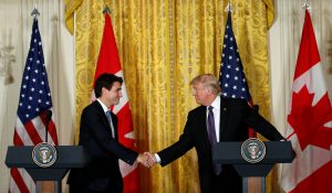 Canadian Prime Minister Justin Trudeau (L) and U.S. President Donald Trump shake hands during a joint news conference at the White House in Washington, U.S., February 13, 2017. Photo by Kevin Lamarque/Reuters