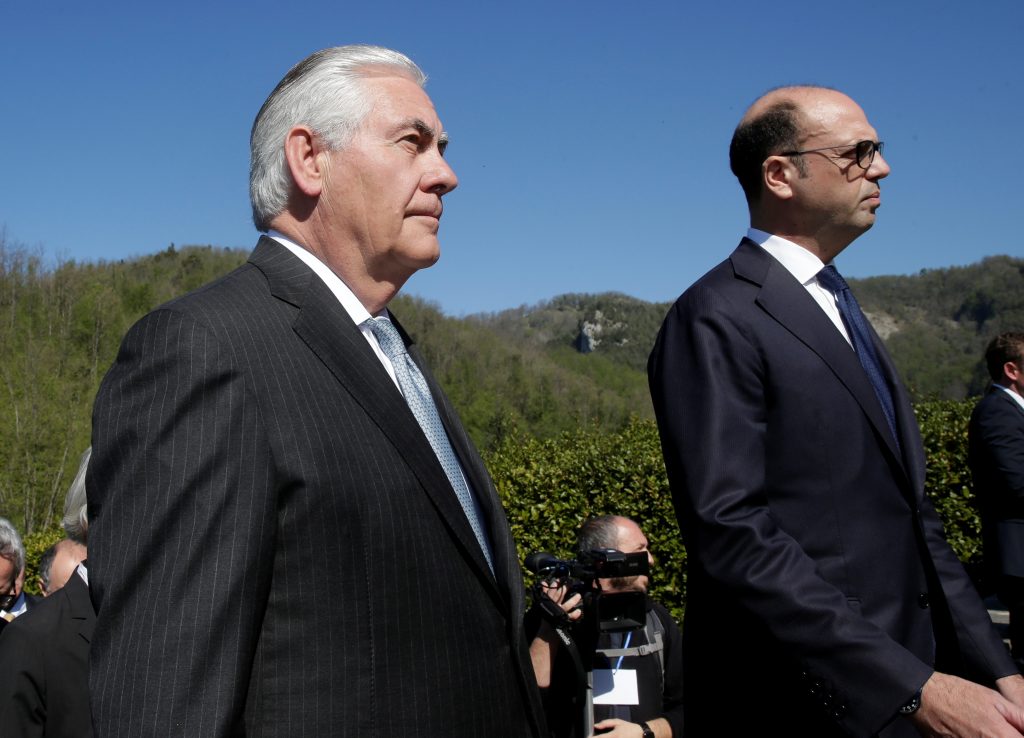 U.S. Secretary of State Rex Tillerson (L) and Italy's Foreign Minister Angelino Alfano arrive to attend a ceremony at the ...