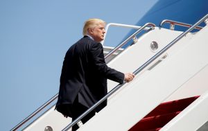 President Donald Trump boards Air Force One upon his departure from Joint Base Andrews in Maryland. Photo by Kevin Lamarque/Reuters