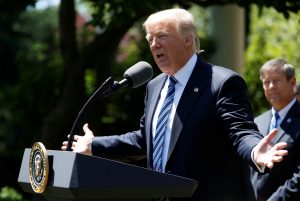 U.S. President Donald Trump presents the U.S. Air Force Academy football team with the Commander-in-Chief trophy in the Rose Garden of the White House in Washington, U.S., May 2, 2017. REUTERS/Joshua Roberts - RTS14TX7