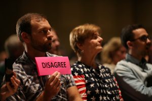In swing districts, voters vent over health care, fear Trump