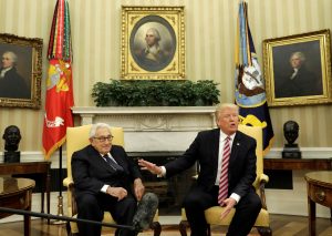 With former Secretary of State Henry Kissinger (L) at his side, U.S. President Donald Trump speaks to reporters after his meeting with Russian Foreign Minister Sergey Lavrov in the Oval Office of the White House in Washington, D.C. Photo by Kevin Lamarque/Reuters