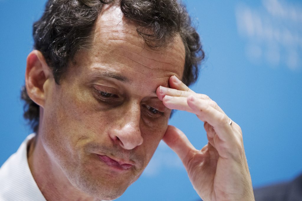 Anthony Weiner, a former U.S. congressman from New York, listens to fellow candidates speak at a 2013 debate in New York. ...