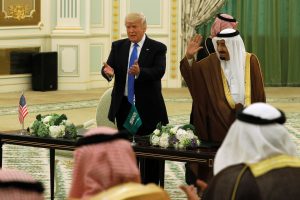 Saudi Arabia's King Salman bin Abdulaziz Al Saud (R) and U.S. President Donald Trump (L) react to applause after signing a joint security agreement at the Royal Court in Riyadh, Saudi Arabia, in May. Photo by Jonathan Ernst/Reuters