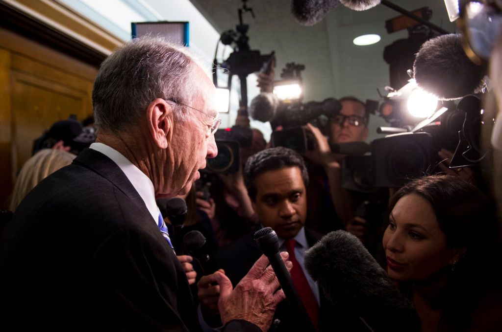 Judiciary chairman Sen. Chuck Grassley, R-Iowa, speaks with reporters as he leaves the Senate Judiciary Committee hearing ...