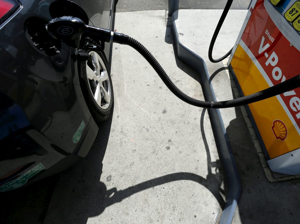 FILE PHOTO: A car is filled with gasoline at a gas station pump in Carlsbad, California. File photo by REUTERS/Mike Blake.