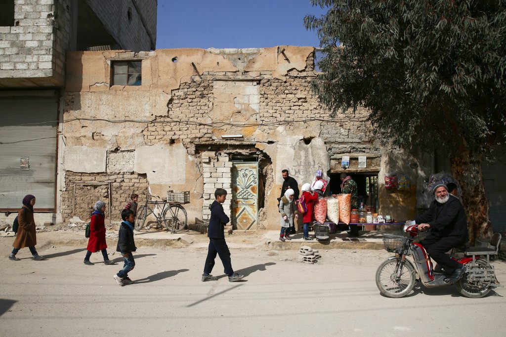 Schoolchildren walk in the rebel held besieged Douma neighbourhood of Damascus, Syria March 8, 2017. REUTERS/Bassam Khabie...
