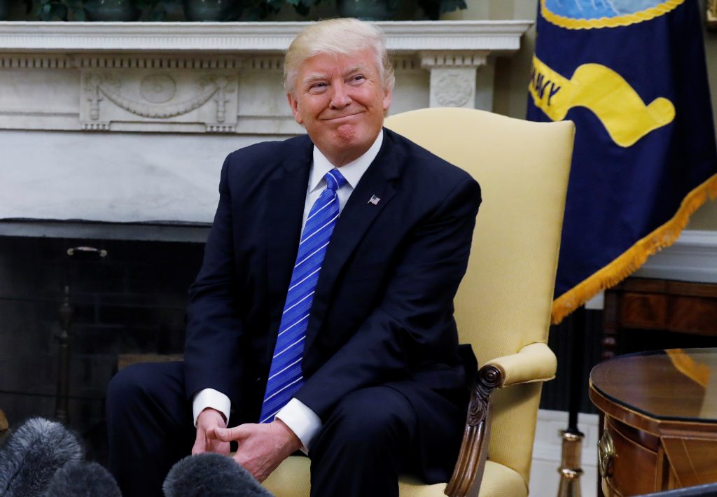 President Donald Trump listens to questions from the media May 15 in the Oval Office during a meeting with Abu Dhabi's Cro...