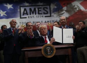 U.S. President Donald Trump signs an executive order on the establishment of office of trade and manufacturing policy during a tour at The Ames Companies in Harrisburg, Pennsylvania, U.S. April 29, 2017. REUTERS/Carlos Barria - RTS14I1F