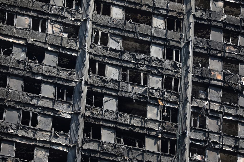The burnt out remains of the Grenfell Tower are seen in North Kensington, London