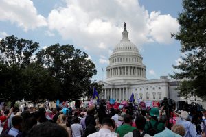 Protestors gather during a demonstration against the Republican repeal of the Affordable Care Act, outside the U.S. Capitol in Washington, U.S., June 21, 2017. REUTERS/Aaron P. Bernstein - RTS182QA