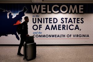 An international passenger arrives at Washington Dulles International Airport in Virginia after the Supreme Court granted parts of the Trump administration's emergency request to put its travel ban into effect later in the week pending further judicial review. Photo by James Lawler Duggan/Reuters