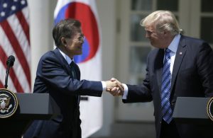 U.S. President Donald Trump greets South Korean President Moon Jae-in prior to delivering a joint statement from the Rose Garden of the White House on June 30, 2017. Photo by Jim Bourg/Reuters