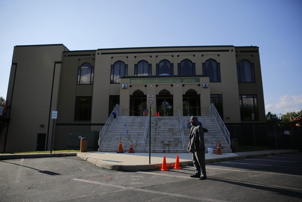 FILE PHOTO: Imam Mohamed Magid stands in front of the All Dulles Area Muslim Society (ADAMS) mosque in Sterling, Virginia,...