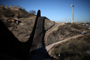A U.S. border patrol agent patrols the U.S. border with Mexico in Nogales