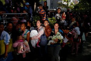 Women carrying babies line up to buy diapers and other supplies outside a pharmacy in Caracas, Venezuela on March 18. Photo by Carlos Garcia Rawlins/Reuters