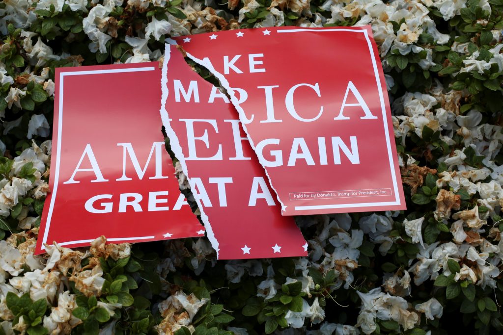 A torn sign rests on a bush during the Trump Free Speech Rally in Portland, Oregon, U.S. June 4, 2017. Photo by David Ryder
