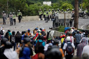 Demonstrators against Venezuela's President Nicolas Maduro clash with riot police in Caracas on June 5. Photo by Carlos Garcia Rawlins/Reuters