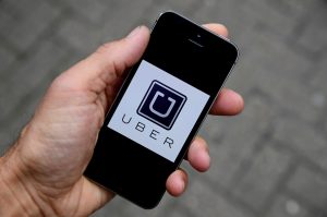 File Photo of Uber app by Toby Melville/Reuters
