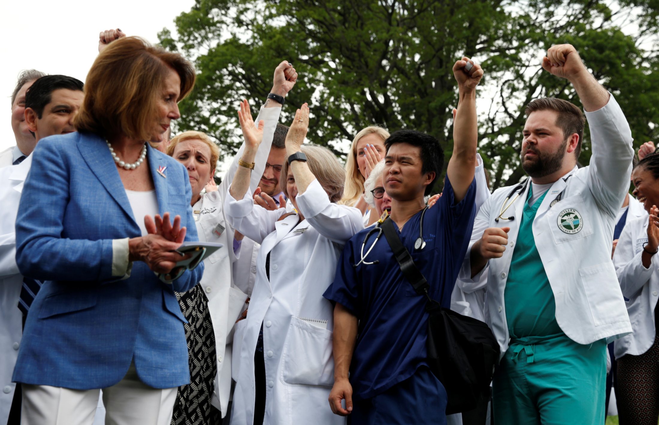 House of Representatives Democratic leader Nancy Pelosi and healthcare workers react to remarks during an event protesting proposed Republican healthcare legislation at the Capitol in Washington, D.C. Photo by Kevin Lamarque/Reuters