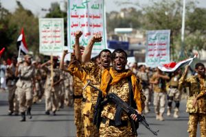 Newly recruited fighters parade outside the U.S. embassy before they join Houthi rebels in the battles at the border with Saudi Arabia and in other parts of Yemen. Photo by Khaled Abdullah/Reuters