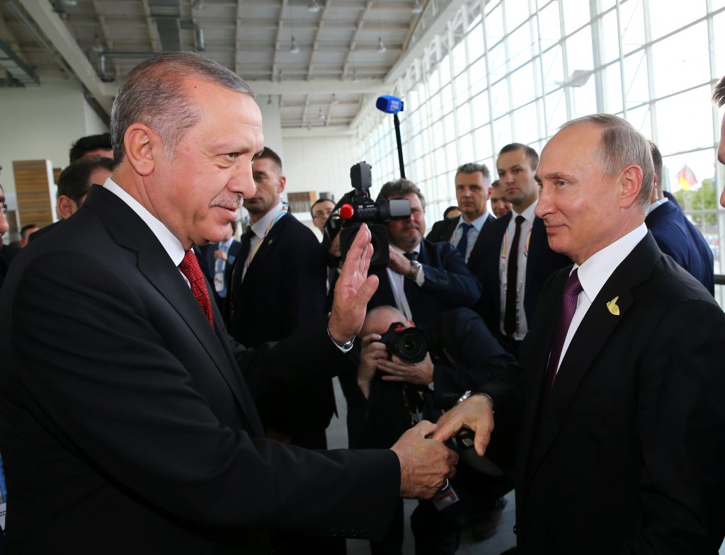 Turkish President Erdogan chats with his Russian counterpart Putin at the G-20 summit in Hamburg