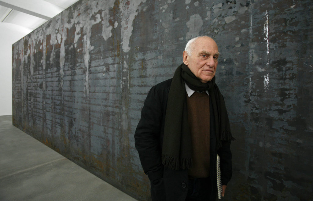 Artist Richard Serra poses for photographers beside one of his works entitled 'Fernando Pessoa' during the unveiling of hi...