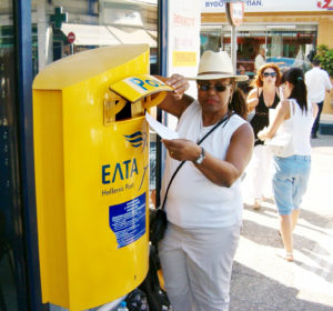 An American woman in Greece with her absentee ballot