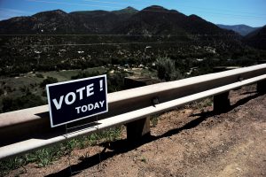 A sign reminds residents to vote in the state's primary election in El Prado, New Mexico, U.S. June 7, 2016. Photo by Brian Snyder/REUTERS