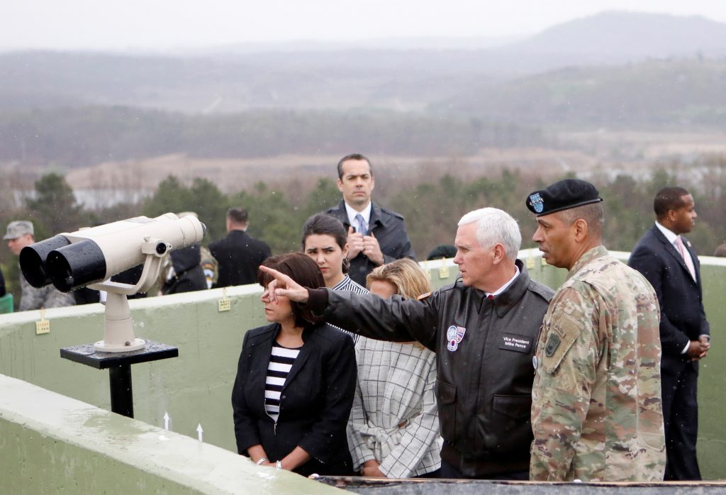 U.S. Vice President Mike Pence looks toward the north from an observation post inside the demilitarized zone separating th...