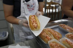 Lobster rolls are for sale in the Massachusetts Grange building on the Avenue of the States during the 100th anniversary of The Eastern States Exposition in West Springfield, Massachusetts, U.S. September 21, 2016. Picture taken on September 21, 2016. REUTERS/Lisa Quinones - RTSOZWS