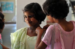 At a school for poor children in India, price of attendance is paying it forward