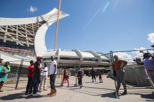 Refugees and some of their Canadians supporters mingle outside Olympic Stadium in Montreal, Quebec, August 5, 2017.  GEOFF ROBINS/AFP/Getty Images)