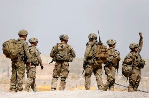 FILE PHOTO: U.S. troops walk outside their base in Uruzgan province, Afghanistan July 7, 2017. REUTERS/Omar Sobhani/File Photo - RTS1CL1M
