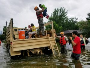 Texas National Guardsmen aid residents flooded by Hurricane Harvey in Houston, Texas, on Aug. 27. Photo by Lt. Zachary West, 100th MPAD/Texas Military Department/Handout via Reuters